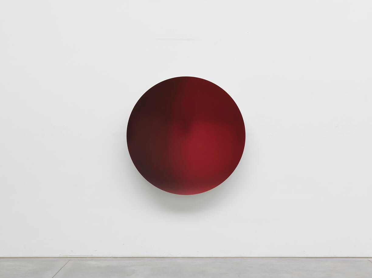 <p>For the third exhibition in East Hampton, Lisson Gallery is pleased to present a recent sculpture by <a href="https://www.lissongallery.com/artists/anish-kapoor" target="_blank">Anish Kapoor</a>. This will be the artist’s second exhibition with the gallery in the United States, following his <a href="https://www.lissongallery.com/exhibitions/anish-kapoor-lisson-nyc" target="_blank">dual presentation at both of Lisson Gallery’s New York spaces</a> in October 2019.</p>
<p>Kapoor is one of the most celebrated and influential sculptors of his generation, known for his monumental and ambitious public structures, as well as his continuous exploration into the manipulation of space throughout his artistic practice. Kapoor’s highly anticipated exhibition at the historic Houghton Hall in Norfolk, England opened in July and runs until November 2020, featuring 21works including the 16-foot stainless steel <em>Sky Mirror</em>.</p>
<p>The sculpture on view in East Hampton, <em>Garnet to Laser Red </em>(2017), is a wall-based semi-reflective concave mirror that fades subtly across shades of deep red. The mirrored surface as a material represents a key component of Kapoor’s oeuvre, whereby both its flawlessly polished surface and the distorted reflection it creates when shaped into highly innovative form, force the viewer to re-examine their relationship to the surrounding environment. The faintly reflective surface coupled with the vibrant, dark crimson in <em>Garnet to Laser Red </em>additionally creates a sense of electricity and intensity ­— invigorating the intimately scaled space. </p>
<p>For its inauguration this summer, Lisson Gallery’s 1,000 square foot <a href="https://www.lissongallery.com/news/lisson-gallery-opens-in-east-hampton" target="_blank">East Hampton space</a> will highlight one work per week by gallery artists – with presentations by Stanley Whitney, Carmen Herrera, Joanna Pousette-Dart, Sean Scully and Leon Polk Smith, among others – featuring both seminal, historic artworks and premiering new bodies of work. This focused format recalls the origins of Lisson Gallery, which was established in 1967 in a storefront window on London’s Bell Street. The new Long Island outpost joins Lisson Gallery’s two other locations in the New York area, including the recent expansion to a second location on West 24th Street in Manhattan’s Chelsea neighborhood.</p>
<p>The gallery will be open to the public Thursday to Monday, from 11am to 4pm. The health and safety of visitors remains a top priority, and strict measures will be implemented in the space to mitigate the spread of COVID-19. A mask will be required for entry, and hand sanitizer will be provided. Please visit our website for further details about the guidelines and to schedule an appointment.</p>